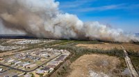 1,100 homes evacuated as firefighters battle fast-moving Florida wildfires