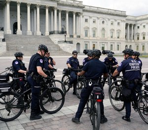 U.S. Capitol Police Officers gather to talk, on Capitol Hill Monday, March 7, 2022 in Washington.