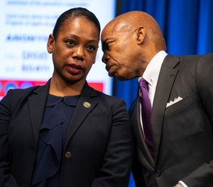 New York Mayor Eric Adams talks with New York City Police Commissioner Keechant Sewell during a news conference Monday, March 14, 2022, in Washington, D.C. (AP Photo/Evan Vucci)