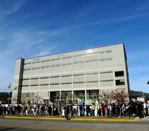 Protesters march in front of the Etowah County Detention Center in Gadsden, Ala., Saturday, Dec. 3, 2011.