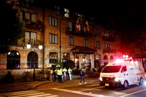 Police stand guard the hotel where Foo Fighters drummer Taylor Hawkins was found dead in Bogota, Colombia, on Saturday.