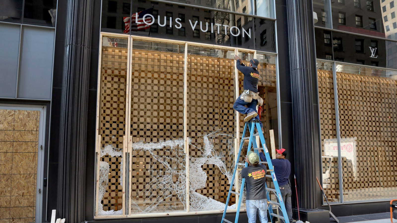 Passing A Louis Vuitton Display Window Stock Photo - Download