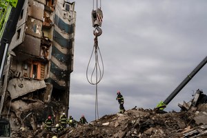 Firefighters work on a destroyed apartment building in the town of Borodyanka, Ukraine, on Saturday. Russian troops occupied the town of Borodyanka for weeks. Several apartment buildings were destroyed during fighting between the Russian troops and the Ukrainian forces in the town around 40 miles northwest of Kyiv.