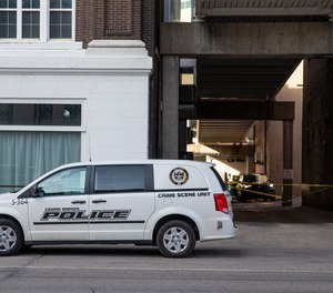 Police vehicles sit outside the Taboo Nightclub and Lounge in Cedar Rapids, Iowa on Sunday, April 10, 2022 to investigate a shooting that occurred early Sunday.