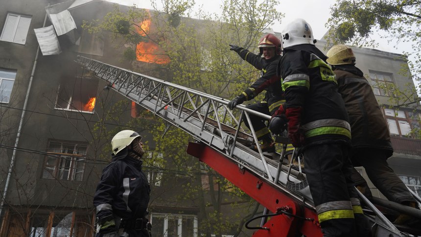 Firefighters work to extinguish fire at an apartments building after a Russian attack in Kharkiv, Ukraine, Sunday, April 17, 2022.