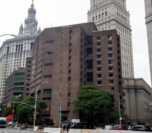 The brown bricked Metropolitan Correctional Center is shown in the foreground with municipal and court facilities in the background, Aug. 13, 2019, in New York.