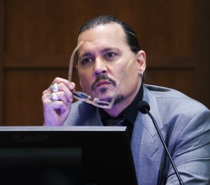 Actor Johnny Depp testifies during the trial at Fairfax County Circuit Court in Fairfax, Va., Wednesday, April 20, 2022. Depp sued his ex-wife Amber Heard for libel in Fairfax County Circuit Court after she wrote an op-ed piece in The Washington Post in 2018 referring to herself as a