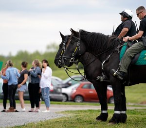 Officers on horseback guard the entrance to designated demonstrator areas near Riverbend Maximum Security Institution as people wait to enter before the scheduled execution of inmate Oscar Smith, Thursday, April 21, 2022, in Nashville, Tenn.