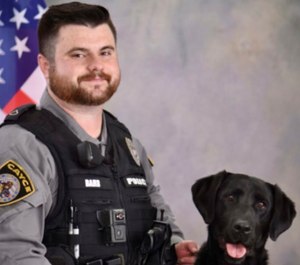 Officer Roy Andrew "Drew" Barr with K-9 Molly.