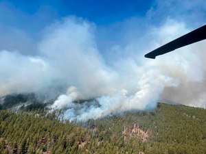 A New Mexico National Guard Aviation UH-60 Black Hawk few Sunday to drop water on the Calf Canyon/Hermits Peak Fire in northern New Mexico.