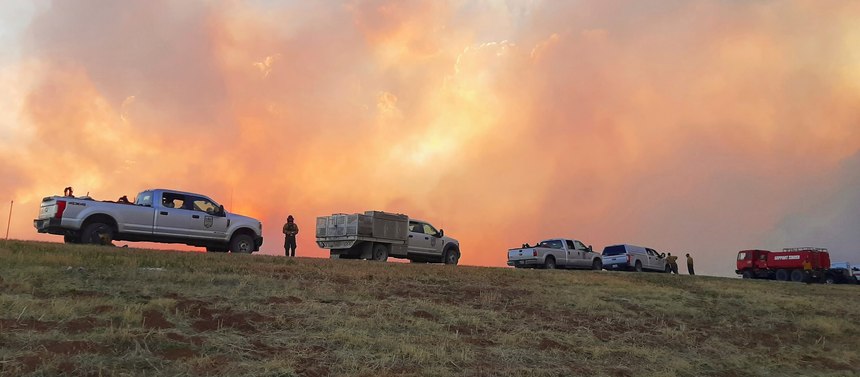 In this Sunday, May 1, 2022 photo provided by Jasper Bivens of Grayback Forestry, plumes of smoke from wildfires are seen from Highway 518, a few miles north of Las Vegas, N.M. New Mexico was in the bull's eye for the nation's latest wave of hot, dry and windy weather.