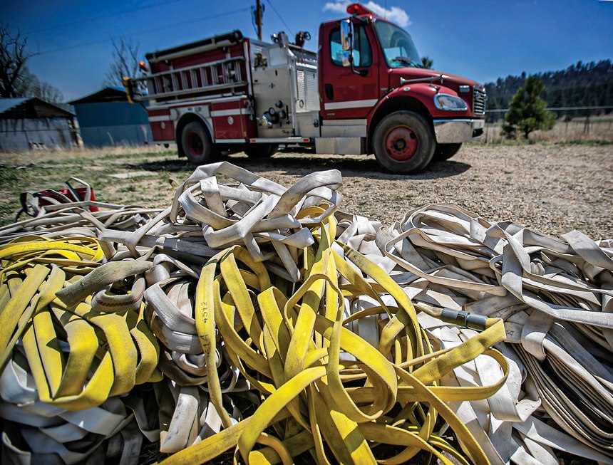 Firehoses lay on the ground in the evacuation area near Mora, N.M., on Wednesday, May 4, 2022, where firefighters have been battling the Hermit's Peak and Calf Canyon fire for weeks. Weather conditions described as potentially historic are on tap for New Mexico on Saturday, May 7, and over the next several days as the largest fire burning in the U.S. chews through more tinder-dry mountainsides. 