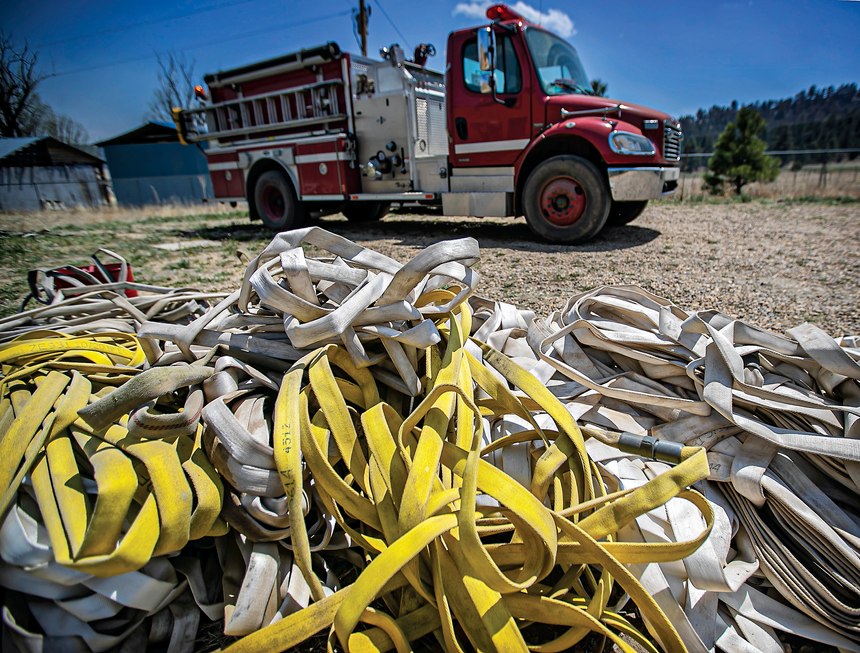 Firehoses lay on the ground in the evacuation area near Mora, N.M., on Wednesday, May 4, 2022, where firefighters have been battling the Hermit's Peak and Calf Canyon fire for weeks. Weather conditions described as potentially historic are on tap for New Mexico on Saturday, May 7, and over the next several days as the largest fire burning in the U.S. chews through more tinder-dry mountainsides.