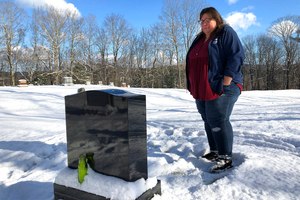 Deb Walker visits the grave of her daughter, Brooke Goodwin, on Dec. 9, 2021, in Chester, Vt. Goodwin, 23, died in March of 2021 of a fatal overdose of the powerful opioid fentanyl plus xylazine, an animal tranquilizer that is making its way into the illicit drug supply.