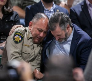 Uvalde County Sheriff Ruben Nolasco, left, is comforted by U.S. Sen. Ted Cruz.