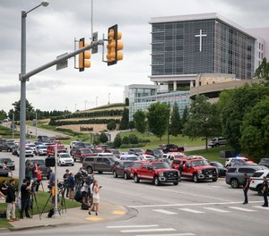 Media gather as Tulsa police and firefighters respond to a shooting at the Natalie Medical Building Wednesday, June 1, 2022. in Tulsa, Okla.