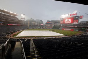 Nationals Park is viewed during a rain delay before a baseball game between the Washington Nationals and the Atlanta Braves on Monday. Two days before that, an EMT and a nurse came to the aid of a fellow baseball fan who was having a heart attack.