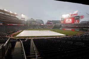 Nationals Park is viewed during a rain delay before a baseball game between the Washington Nationals and the Atlanta Braves on Monday. Two days before that, an EMT and a nurse came to the aid of a fellow baseball fan who was having a heart attack.