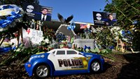 Heartbroken community mourns 2 slain officers: 'They're our boys'