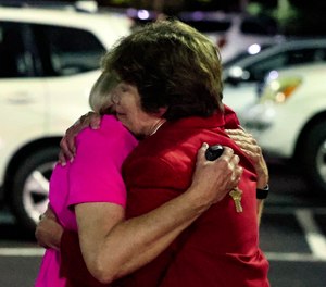Church members console each other after a shooting at the Saint Stephen’s Episcopal Church on Thursday, June 16, 2022 in Vestavia, Ala.