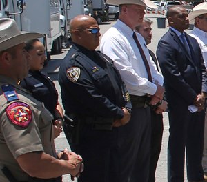 Uvalde School Police Chief Pete Arredondo, third from left, stands during a news conference outside of the Robb Elementary school in Uvalde, Texas Thursday, May 26, 2022.