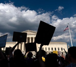 Abortion-rights activists protest outside the Supreme Court in Washington, Saturday, June 25, 2022.