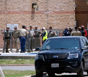 Law enforcement, and other first responders, gather outside Robb Elementary School following the May 24 school shooting in Uvalde, Texas.