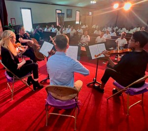 In this video frame grab provided by The Mississippi Department of Corrections, members of a string quartet of First Baptist Church of Jackson perform before inmates at the Central Mississippi Correctional Facility in Pearl, Miss., on Tuesday, July 19, 2022. (Leo Honeycutt/The Mississippi Department of Corrections via AP)