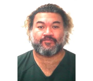 This undated photo provided by the Hawaii Department of Public Safety shows Samuela Tuikolongahau Jr., who U.S. authorities said used counterfeit checks to try to bail out three people from a Hawaii jail. (Hawaii Department of Public Safety via AP)