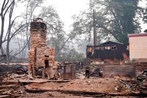 A structure in Klamath River, Calif., is seen destroyed by the McKinney Fire on Saturday
