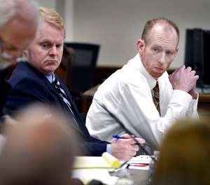 Chad Isaak, right, of Washburn, sits with his defense team during the third day of his murder trial at the Morton County Courthouse in Mandan, N.D., on Wednesday, Aug. 4, 2021. Authorities say Isaak, convicted in a 2019 quadruple slaying, has killed himself in prison. Isaak was appealing his convictions in the killings of the owner of a Mandan property management business and three workers there. (Mike McCleary/The Bismarck Tribune via AP, File)