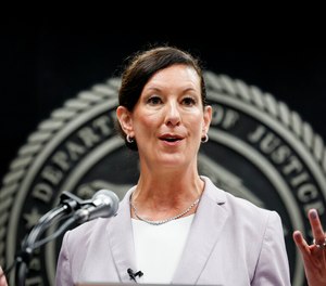 Colette Peters, director of the federal Bureau of Prisons, speaks after being sworn in at BOP headquarters.