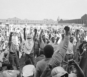 Inmates at Attica State Prison in Attica, N.Y., raise their hands in clenched fists in a show of unity, Sept. 1971, during the Attica uprising, which took the lives of 43 people. New York authorities have lifted a ban that had stopped state prison inmates from reading a book about the 1971 Attica Correctional Facility uprising following a First Amendment lawsuit brought by its author. (AP Photo, File)