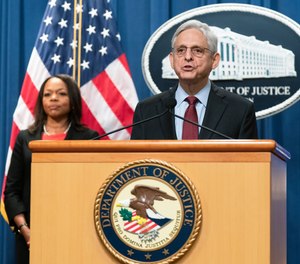 Attorney General Merrick Garland with Assistant Attorney General Kristen Clarke for the Civil Rights Division, speaks during a news conference at the Department of Justice in Washington, Thursday, Aug. 4, 2022.