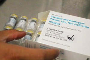 Jonathan Parducho, a pharmacist, removes a tray of vials of of the Jynneos vaccine for monkeypox from a box containing 20 doses, in the vaccine hub at Zuckerberg San Francisco General Hospital on July 29 in San Francisco.