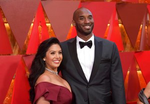 Vanessa Bryant (left) and Kobe Bryant arrived at the Oscars in Los Angeles on March 4, 2018. Vanessa Bryant is suing the Los Angeles County Sheriff's Department and the fire department over photos deputies shared of the remains of NBA star Kobe Bryant, his daughter and seven others killed in a helicopter crash in 2020.
