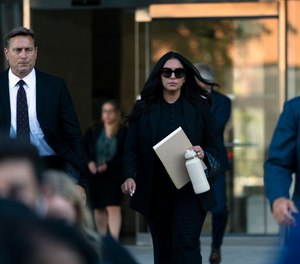 Vanessa Bryant, center, the widow of Kobe Bryant, leaves a federal courthouse in Los Angeles, Wednesday, Aug. 10, 2022.