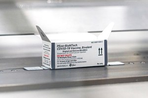 This August 2022 photo provided by Pfizer shows packaging for the company's updated COVID-19 vaccine during production in Kalamazoo, Mich. U.S. regulators authorized updated COVID-19 boosters, the first to directly target today's most common omicron strain.