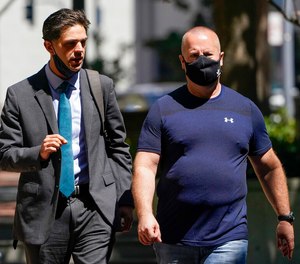 James Theodore Highhouse, right, arrives for his sentencing hearing at U.S. District Court with his attorney Jaime Dorenbaum, left, in Oakland, Calif., Wednesday, Aug. 31, 2022. Highhouse pleaded guilty to sexually abusing an inmate while working as a prison chaplain at a federal women's prison in Dublin, Calif. (AP Photo/Godofredo A. Vásquez)