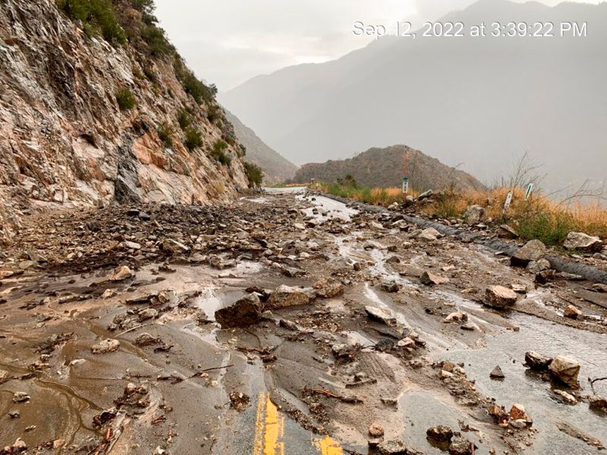 This Monday afternoon image released by Caltrans District 8 shows mudslides that closed part of Highway SR-38 in the San Bernardino Mountains, Calif. The mudflows and flash flooding occurred in parts of the San Bernardino Mountains where there are burn scars, areas where there's little vegetation to hold the soil, from the 2020 wildfires.