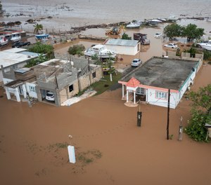 Homes are flooded on Salinas Beach after the passing of Hurricane Fiona in Salinas, Puerto Rico, Monday, Sept. 19, 2022.