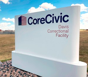 The Davis Correctional Facility, a private prison in Holdenville, Oklahoma, operated by Tennessee-based CoreCivic, is shown on Sept. 20, 2022. The 1,700-bed men’s prison where a correctional officer was fatally stabbed this summer has struggled to hire and retain staff and was operating at about 70% of its contractually obligated staffing level, according to a 2021 audit of the facility.