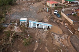 A house lays in the mud after it was washed away by Hurricane Fiona at Villa Esperanza in Salinas, Puerto Rico, Wednesday, Sept. 21, 2022. Fiona left hundreds of people stranded across the island after smashing roads and bridges, with authorities still struggling to reach them four days after the storm smacked the U.S. territory, causing historic flooding.