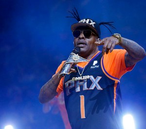 Coolio performs at halftime of an NBA basketball game between the Phoenix Suns and the New Orleans Pelicans on April 5, 2019, in Phoenix. Coolio, the rapper who was among hip-hop's biggest names of the 1990s with hits including “Gangsta's Paradise” and “Fantastic Voyage,” died Wednesday, Sept. 28, 2022, at age 59, his manager said. (AP Photo/Rick Scuteri, File)