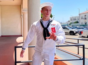 Seaman Ryan Sawyer Mays walks past reporters at Naval Base San Diego before entering a Navy courtroom on Aug. 17. He was acquitted Friday.