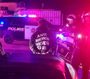 Police detain drivers in Reno, Nev., early Saturday, Oct. 1, 2022.