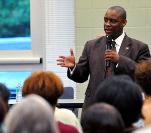 Clayton County Sheriff Victor Hill speaks at a candidate forum in Rex, Ga., on Aug. 16, 2012. Hill stands accused of punishing detainees by having them strapped into a restraint chair for hours even though they posed no threat and obeyed instructions. A federal grand jury in April 2021 indicted Hill, saying he violated the civil rights of four people in his custody. Jury selection is set to begin Wednesday, Oct. 12, 2022, and the trial is expected to last at least two weeks.