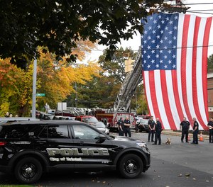Police officers from Bristol, Conn. gather with other towns at the scene where two police officers killed, Thursday, Oct. 13, 2022, in Bristol, Conn. The deaths of two Connecticut police officers and the wounding of a third during an especially violent week for police across the U.S. fit into a grim pattern, law enforcement experts say. Even as the number of officers has dropped in the past two years, the number being targeted and killed has risen.