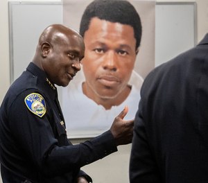 Stockton Police Chief Stanley McFadden speaks during a press conference at the Stockton Police Department headquarters in Stockton, Calif., on the arrest of suspect Wesley Brownlee in the Stockton serial killings on Saturday, Oct. 15, 2022. Behind McFadden is a booking photo of Brownlee.