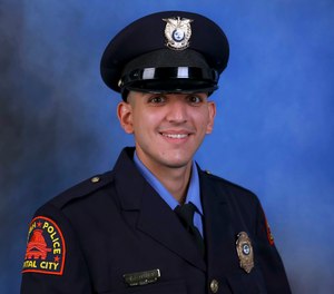 This photo provided by the Raleigh Police Department shows Officer Gabriel Torres, one of the victims of a shooting attack that stretched from the streets of a Raleigh neighborhood to a nearby walking trail last Thursday.